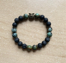 Load image into Gallery viewer, 6.9” bronze owl charm Stretchy Bracelet- lava beads and 8mm African jasper beads Aromatherapy bracelet