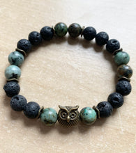 Load image into Gallery viewer, 6.9” bronze owl charm Stretchy Bracelet- lava beads and 8mm African jasper beads Aromatherapy bracelet