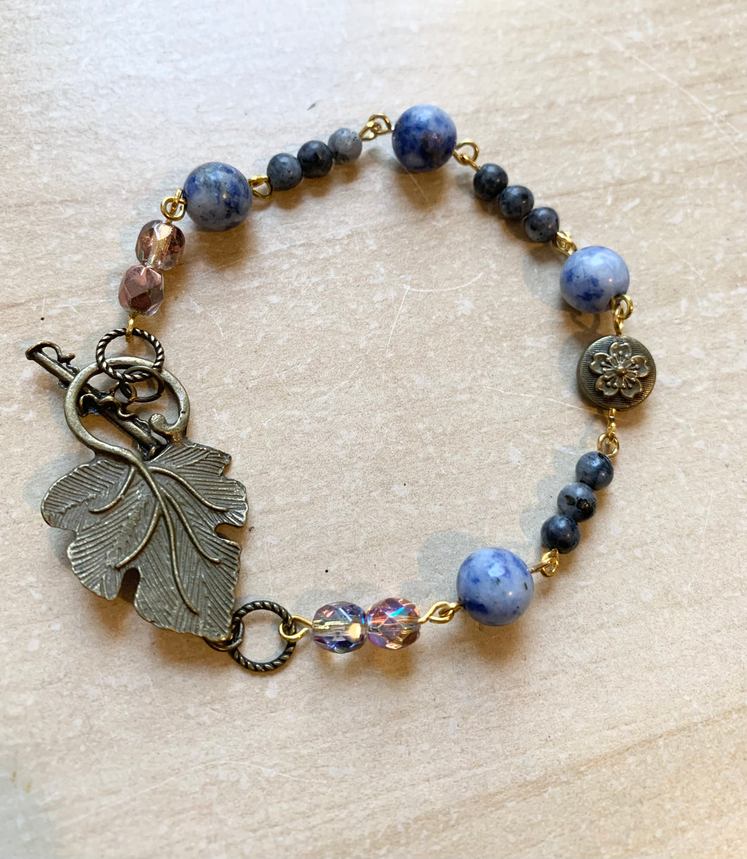 8.25” Unique Leaf Clasp bronze bracelet with sodalite